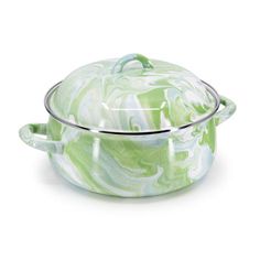 a green and white marbled casserole on a white background with a glass lid