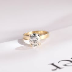 an engagement ring with a single diamond in the center