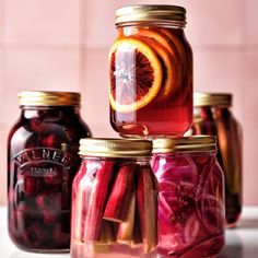 jars filled with pickles and orange slices