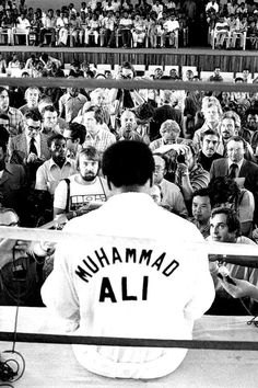 a baseball player standing in front of a crowd