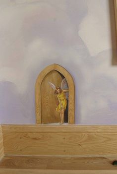 a painting of a fairy on the wall