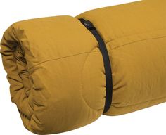 the back end of a yellow pillow with black straps