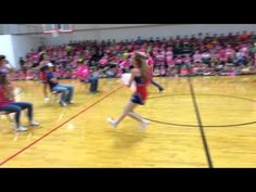 the girls are playing basketball on the court