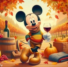 a mickey mouse holding a glass of wine in front of fall leaves and pumpkins