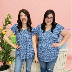 Denim tops are always a flattering color to wear! Spring Casual Flowy V-neck Top, Casual Flowy V-neck Top, Printed Flowy V-neck Tops, Blue Flowy V-neck Top, Casual Blue Paisley Print Tops, Casual Blue Flutter Sleeve Tops, Casual Short Sleeve V-neck Top With Floral Print, Casual Summer V-neck Top With Floral Print, Casual Floral Print Short Sleeve V-neck Top