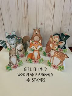 a group of wooden animals sitting on top of a table