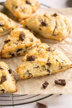 chocolate chip scones sitting on top of parchment paper