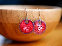 This pair of red bubbly short dangle earrings was created by Jessica Adams at Christ Centered Ironworks. The earrings are round copper discs that have been enameled via the process of torch firing. These earrings were created to have a simple elegance in a modern styling. The enamel is glass and is quite glossy. These round earrings can dress up a casual outfit or accentuate eveningwear. These short dangle earrings hang just below the ear.If you would like to see more copper enamel jewelry, chec Jessica Adams, Copper Necklace Pendant, 7 Year Anniversary Gift, Black And White Necklaces, Copper Anniversary Gifts, Circle Jewelry, Copper Anniversary, 7th Anniversary Gifts, Earrings Circle