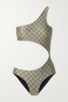 Gucci's 'Love Parade' collection celebrates glamour and escapism. This swimsuit (which could easily pass for a vintage style) is made from a lustrous stretch fabric printed with archival 'GG' lettering. It has a sweeping one-shoulder shape and a curving cutout. Luxury Swimsuits, Bathing Suit Designs, Cutout Swimsuit, Best Swimsuits, Swimsuit Design, Vintage Swimsuits, Cut Out Swimsuits, Designer Swimwear