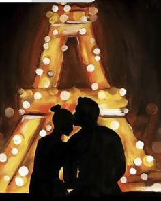 two people are standing in front of the eiffel tower with lights on it