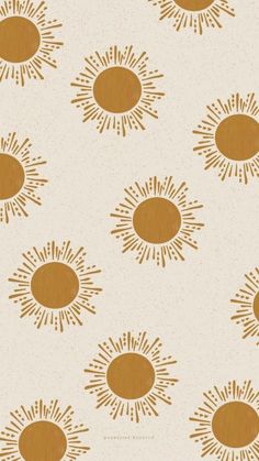 an orange and white wallpaper with sunbursts on it