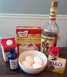 ingredients to make cake sitting on top of a wooden table