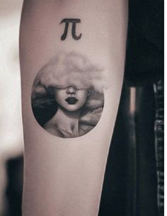 a woman's face with pi on her arm