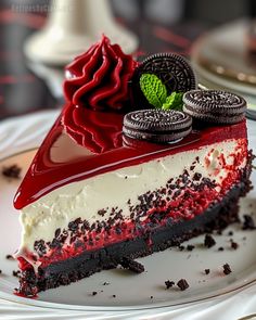 a piece of cake on a plate with oreo cookies and red velvet frosting