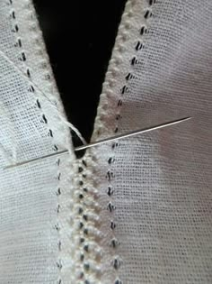 a close up view of a piece of fabric with some thread on it and the stitching being sewn