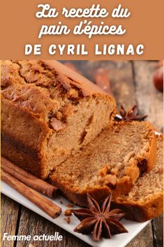 a loaf of bread sitting on top of a plate next to an orange and star anise