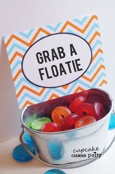 there is a card that says grab a floatie in a bucket with jelly beans