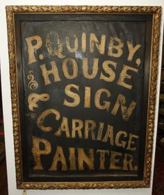 a sign that is on the wall in front of a door saying, pound house and sign carriage painter