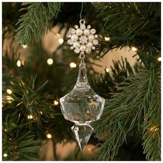 a glass ornament hanging from a christmas tree