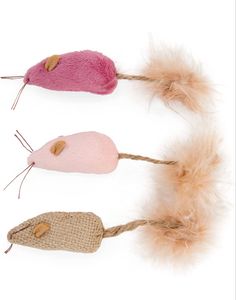 three different types of mouses with feathers on them, one pink and one brown