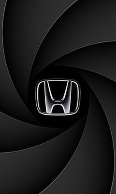 an abstract black and white photo with a honda emblem