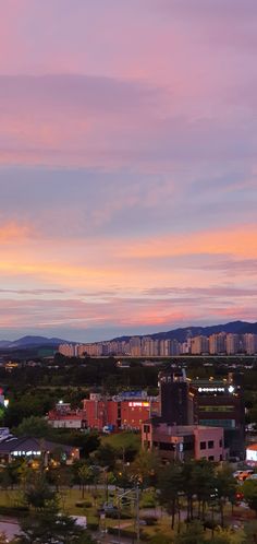 an aerial view of a city at sunset