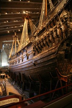 an old ship is on display in a museum