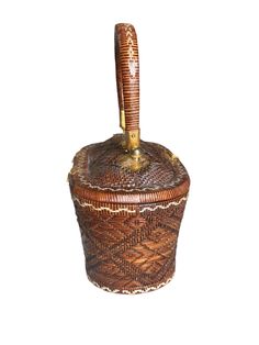 a brown and white basket with a wooden handle on the top, sitting in front of a white background