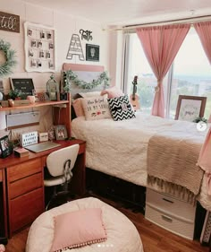 a bedroom with a bed, desk and window