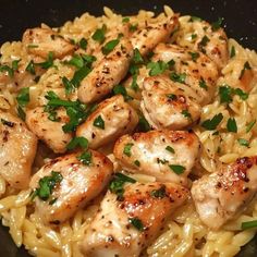 pasta with chicken and parsley in a skillet