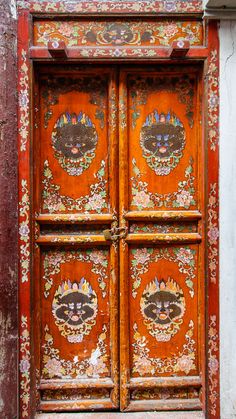 an old wooden door with ornate designs on it