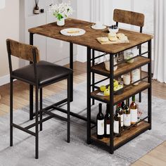 a kitchen table with two chairs next to it and wine bottles on the shelf below