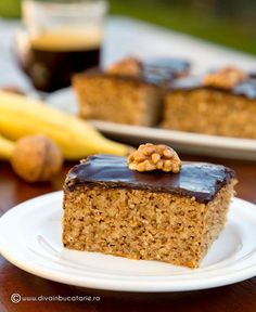 a piece of cake sitting on top of a white plate next to bananas and other food