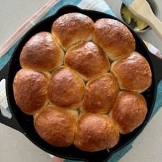 a pan filled with bread on top of a table