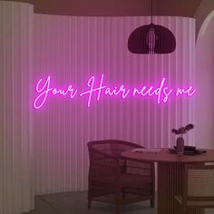 a pink neon sign that says your hair needs me