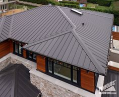 an aerial view of a house with metal roofing