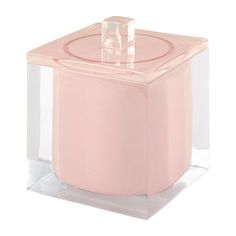 a pink candle holder with a clear lid and square design on the front, set against a white background