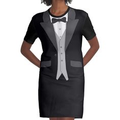 a woman in a tuxedo and bow tie is posing for the camera with her hands on her hips