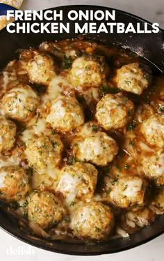 a pan filled with meatballs covered in gravy