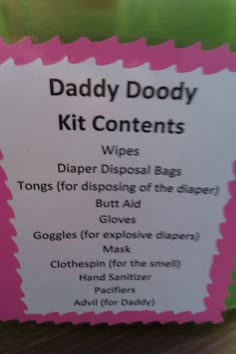 a pink and white sign that says daddy doody kit contents with instructions on it