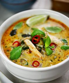 a close up of a bowl of soup on a table