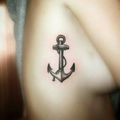 an anchor tattoo on the shoulder