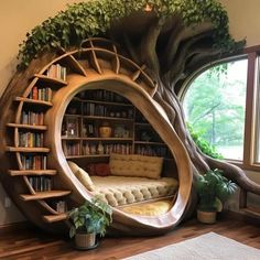 a room with bookshelves and a couch in the shape of a tree