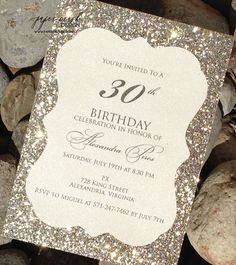 a birthday party card sitting on top of rocks with the number 30 printed on it