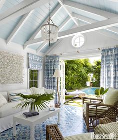 a living room filled with furniture and a pool