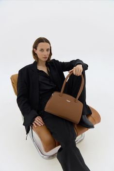 The Tan Leather Shoulder Bag Margot is a must-have for anyone with style. With its spacious, structured design, it offers functionality and elegance. Handcrafted with attention to detail, it complements any outfit, in an enduring piece. Classic Travel Baguette Bag With Top Carry Handle, Classic Baguette Bag With Top Handle For Travel, Classic Baguette Bag With Top Carry Handle For Travel, Classic Satchel Baguette Bag For Business, Classic Business Tote Baguette Bag, Classic Business Baguette Bag Tote, Classic Business Baguette Tote Bag, Classic Soft Leather Office Bag, Office Baguette Satchel Bag With Detachable Handle