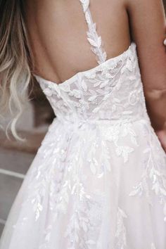 the back of a woman's wedding dress