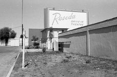 a black and white photo of a sign for rodeo drive in the desert