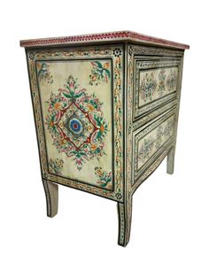 an ornately painted chest with drawers on one side and floral designs on the other