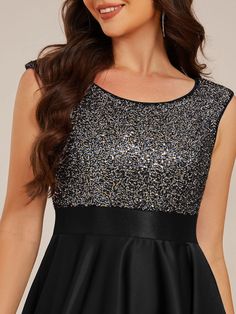 Dazzle in this Sleeveless Sequin Top High-Low Formal Evening Dress. The sparkling sequin bodice adds a touch of glamour, while the satin high-low skirt creates a stunning silhouette that moves with elegance. Perfect for formal occasions, this dress effortlessly blends sophistication with a bold style statement. Its sleeveless design and flattering fit ensure comfort throughout the evening, making it a go-to for your next big event. Fit: Please refer to size chart. Length: High-Low. Sleeve Style: Sleeveless. Closure: It is Concealed a Zipper Up The Back. Undergarments: It is not padded, with lining. Fabric:The garment comprises sequin&satin. Stretch: Fabric is no stretch. Sleeveless Sequin Glitter Dress For Prom, Evening Sequin Dress With Shimmer, Sleeveless, Evening Sequin Sleeveless Dress With Shimmer, Sleeveless Contrast Sequin Evening Dress For Night Out, Evening Sleeveless Shimmer Dress, Sleeveless Sequin Dress With Glitter For Prom, Evening Shimmer Sleeveless Dress, Holiday Sleeveless Evening Dress With Contrast Sequin, Holiday Contrast Sequin Sleeveless Evening Dress